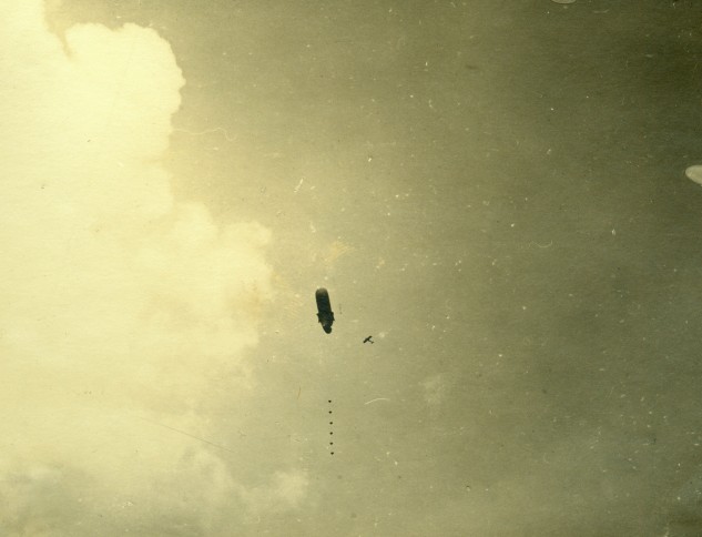 Rare photograph taken by an officer of IR145 at the Somme in 1917, caption reads "One of our balloons under attack" - I would love to know what type of aircraft we have here.